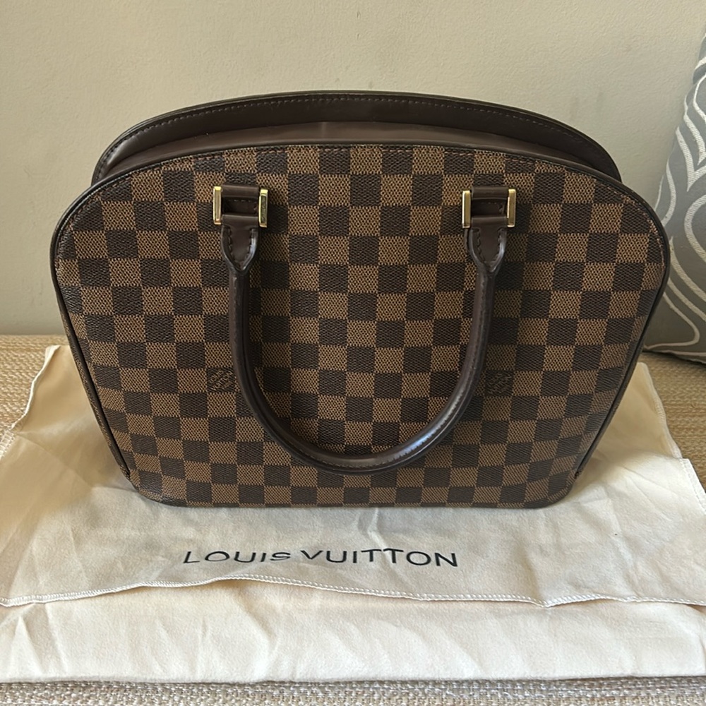 Damier Ebene Sarria Louis Vuitton handbag.
